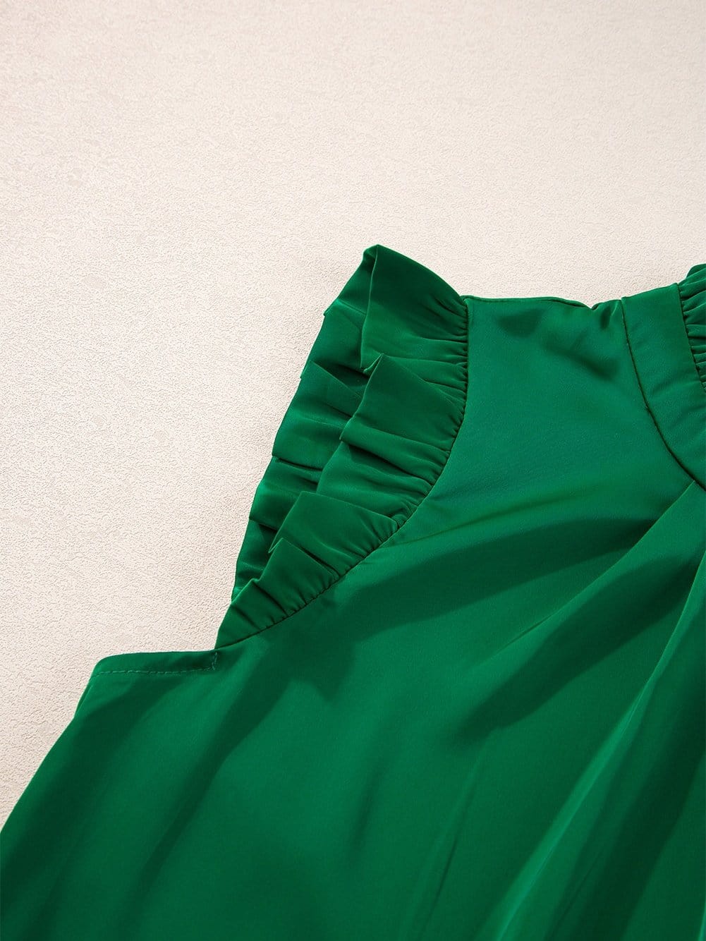 Vibrant Green Pleated Sleeveless Blouse with Frilled Mock Neck